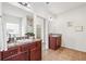 Bathroom featuring double sinks, granite countertops, tile floors, and decor at 2859 Woodward Down Trl, Buford, GA 30519