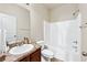 Bathroom featuring a single sink vanity and shower-tub combination at 2859 Woodward Down Trl, Buford, GA 30519