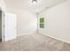Bedroom featuring a neutral color scheme, plush carpet, and plenty of natural light at 2859 Woodward Down Trl, Buford, GA 30519