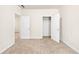 Bedroom featuring two doorways, neutral walls, plush carpet, and a spacious closet at 2859 Woodward Down Trl, Buford, GA 30519