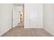 Neutral bedroom featuring carpeted floors, white walls, and doors at 2859 Woodward Down Trl, Buford, GA 30519