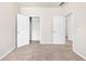 Bedroom featuring neutral walls, carpeted floors and closet space at 2859 Woodward Down Trl, Buford, GA 30519