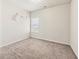 Bedroom featuring a neutral color scheme, plush carpet, and one large window at 2859 Woodward Down Trl, Buford, GA 30519
