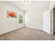Bedroom with neutral carpet, natural light, and a flower art piece at 2859 Woodward Down Trl, Buford, GA 30519