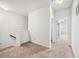 Hallway with neutral carpet leading to multiple rooms at 2859 Woodward Down Trl, Buford, GA 30519