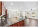 Spacious kitchen with an island, granite countertops, stainless steel appliances, and open layout to the living area at 2859 Woodward Down Trl, Buford, GA 30519