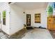 Covered patio with outdoor space, a door, and nearby greenery at 2859 Woodward Down Trl, Buford, GA 30519