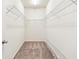 Spacious walk-in closet with wire shelving, carpeted floors, and ample storage at 2859 Woodward Down Trl, Buford, GA 30519