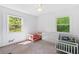 Bedroom featuring carpeted floors, and multiple windows with views at 431 Hickory Se Ln, Smyrna, GA 30082