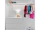 Organized closet with clothes rack, shelves, and a white dresser creates an easy storage space at 431 Hickory Se Ln, Smyrna, GA 30082