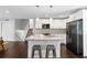 Modern kitchen boasts stainless steel appliances, granite countertops, and an island with seating at 431 Hickory Se Ln, Smyrna, GA 30082