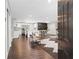 Bright, open-concept living space with hardwood floors, modern kitchen, and stylish dining area at 431 Hickory Se Ln, Smyrna, GA 30082