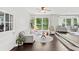 Bright living room featuring hardwood floors, large windows, and stylish, comfortable furnishings at 431 Hickory Se Ln, Smyrna, GA 30082