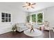 Cozy living room featuring a large window, comfortable seating, and stylish decor at 431 Hickory Se Ln, Smyrna, GA 30082
