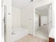 Bright bathroom with a soaking tub and walk-in shower at 230 E Ponce De Leon Ave # 104, Decatur, GA 30030