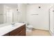 Bathroom featuring a single vanity, a toilet and glass door shower at 230 E Ponce De Leon Ave # 104, Decatur, GA 30030