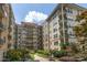 Exterior view of the building with community courtyard at 230 E Ponce De Leon Ave # 104, Decatur, GA 30030