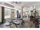Well-equipped gym with modern weight machines, benches, and ceiling fans for a complete fitness experience at 230 E Ponce De Leon Ave # 104, Decatur, GA 30030