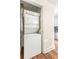 Laundry closet with stackable washer and dryer unit at 230 E Ponce De Leon Ave # 104, Decatur, GA 30030