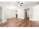 Open-concept living space with updated flooring and a view of the adjacent kitchen and dining area at 230 E Ponce De Leon Ave # 104, Decatur, GA 30030