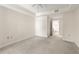 Large main bedroom featuring plush carpet, ceiling fan, neutral walls, and ensuite bathroom at 230 E Ponce De Leon Ave # 104, Decatur, GA 30030