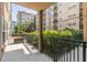 Private patio overlooking the community's manicured landscaping at 230 E Ponce De Leon Ave # 104, Decatur, GA 30030