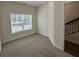 A bright bedroom with a window and carpet at 5455 Blossomwood Sw Trl, Mableton, GA 30126