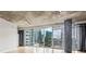 Living room featuring concrete ceilings and floor-to-ceiling windows offer amazing city views at 950 W Peachtree Nw St # 812, Atlanta, GA 30309