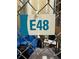 A secured storage unit with the designation E48 to safely keep belongings at 950 W Peachtree Nw St # 812, Atlanta, GA 30309