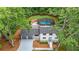 Aerial view of home with pool and lush surrounding greenery at 9805 Buice Rd, Alpharetta, GA 30022