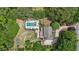 Bird's-eye view displays a private pool, hot tub, outdoor seating, and mature trees at 9805 Buice Rd, Alpharetta, GA 30022