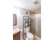 Bathroom featuring a stand up shower, toilet, vanity, and shelving at 9805 Buice Rd, Alpharetta, GA 30022