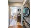 Bathroom featuring double sinks and in-unit washer/dryer at 9805 Buice Rd, Alpharetta, GA 30022