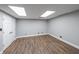Bedroom featuring wood floors, white walls and a double door closet at 9805 Buice Rd, Alpharetta, GA 30022
