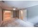 Bedroom with carpet, a ceiling fan, access to another room, and a closet at 9805 Buice Rd, Alpharetta, GA 30022