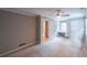 Bedroom featuring neutral walls, carpet, a ceiling fan, and a built-in desk area at 9805 Buice Rd, Alpharetta, GA 30022