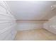 Closet with metal shelving and a beige carpeted floor at 9805 Buice Rd, Alpharetta, GA 30022