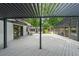 Spacious outdoor deck with pergola leading to screened pool, seating area, and outdoor kitchen at 9805 Buice Rd, Alpharetta, GA 30022