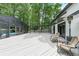 Expansive outdoor deck featuring a screened-in pool, pergola, and comfortable seating, perfect for entertaining at 9805 Buice Rd, Alpharetta, GA 30022