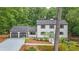 Charming two-story home with a well-maintained front yard and attached two-car garage at 9805 Buice Rd, Alpharetta, GA 30022