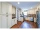 Modern kitchen featuring stainless steel appliances and granite countertops at 9805 Buice Rd, Alpharetta, GA 30022