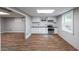 Kitchen featuring white cabinets, stainless steel appliances, and subway tile backsplash at 9805 Buice Rd, Alpharetta, GA 30022