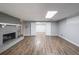Living room with wood floors, brick fireplace and white mantel at 9805 Buice Rd, Alpharetta, GA 30022