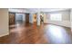 Open-concept living room featuring hardwood floors and rustic sliding barn doors at 9805 Buice Rd, Alpharetta, GA 30022