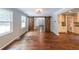 Bright and airy living room with hardwood floors and view of the kitchen at 9805 Buice Rd, Alpharetta, GA 30022