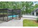 Relaxing pool area features screened enclosure, hot tub, and a spacious deck for entertaining guests at 9805 Buice Rd, Alpharetta, GA 30022