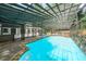 Enjoy a refreshing swim in the screened-in pool surrounded by lush greenery and ample seating at 9805 Buice Rd, Alpharetta, GA 30022