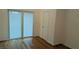 Bedroom with sliding glass doors and closet that fill the area with natural light at 1092 Hillcrest Se Dr, Atlanta, GA 30316