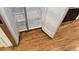 Stainless steel refrigerator with open doors next to hardwood floors and white walls at 1092 Hillcrest Se Dr, Atlanta, GA 30316
