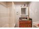Full bathroom with tiled walls, vanity, and shower with curtain at 1422 Cassville Nw Rd, Cartersville, GA 30121